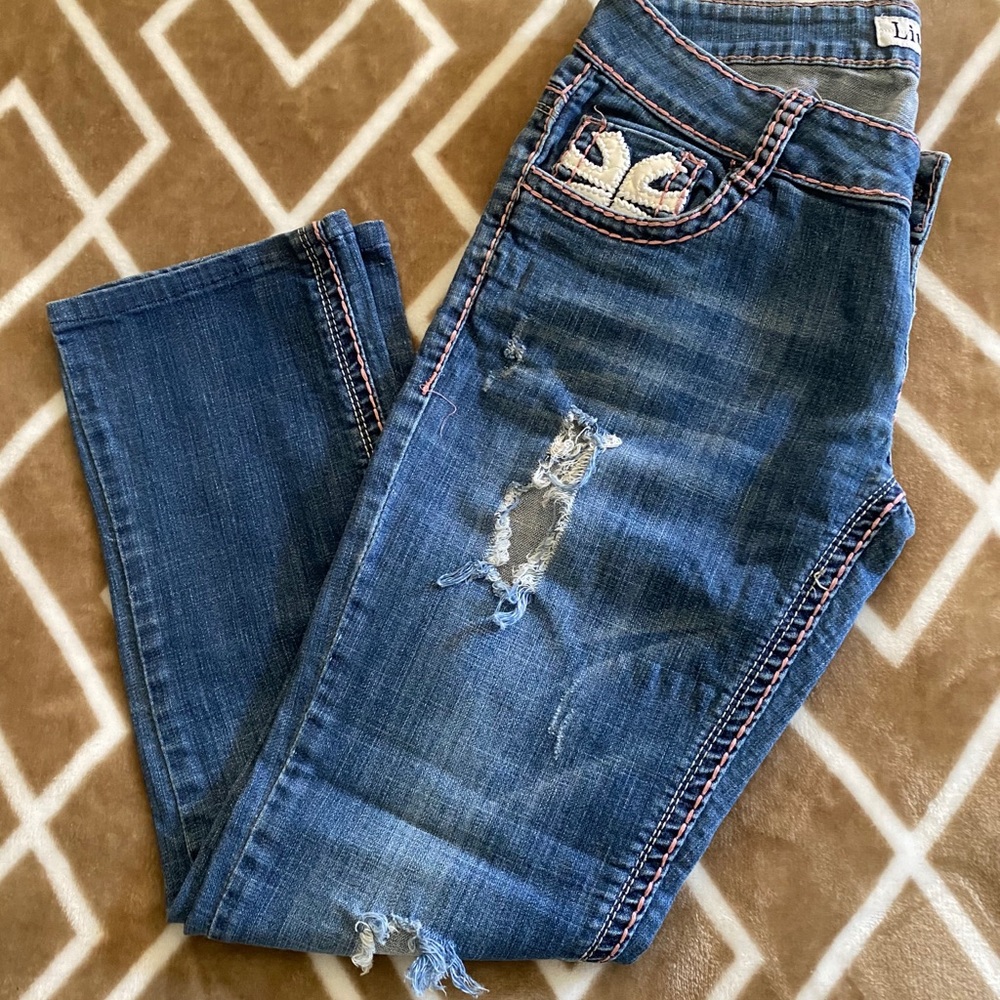 Liuce’s Distressed Jeans